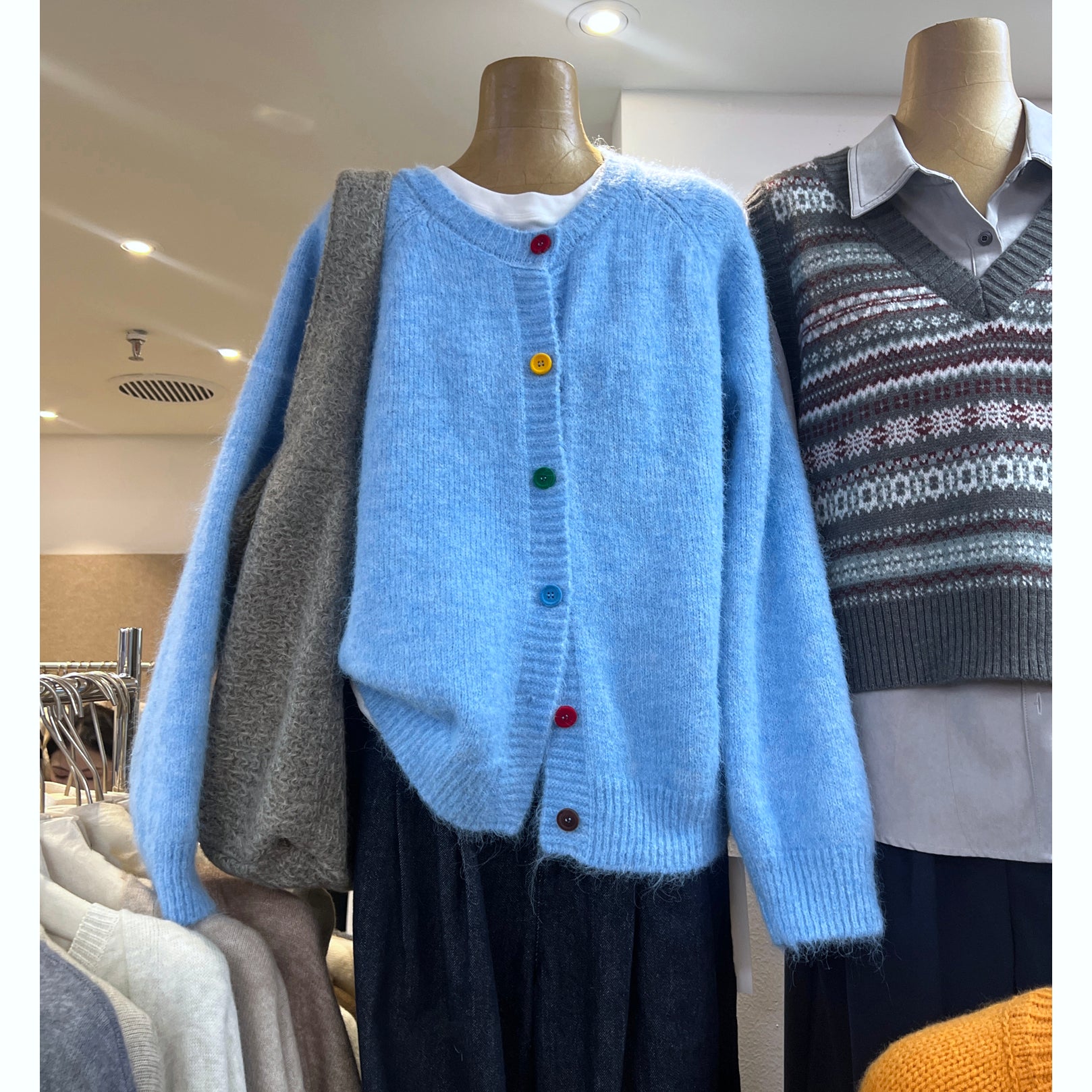 Women's sky blue fuzzy knit cardigan sweater with colorful buttons and oversized fit