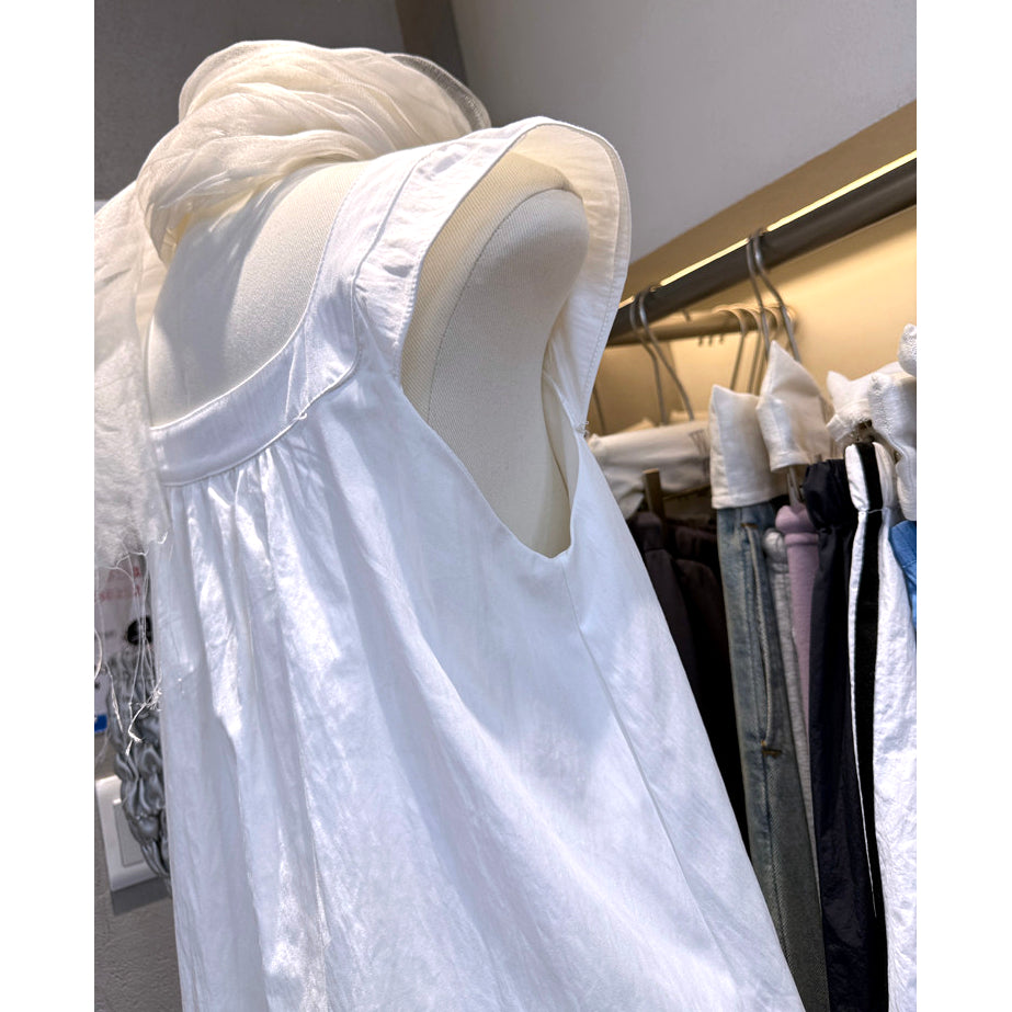 Side view of white Peter Pan collar babydoll mini dress