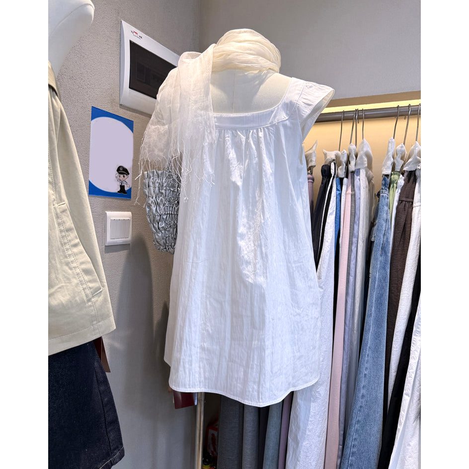 Back view of white Peter Pan collar babydoll mini dress